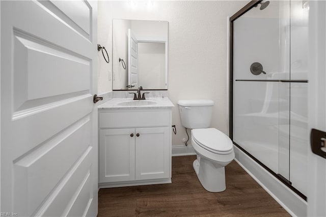 5376 Kenmere Ln, Smithfield, VA 23430 - full bath featuring a shower stall, vanity, toilet, wood finished floors, and baseboards