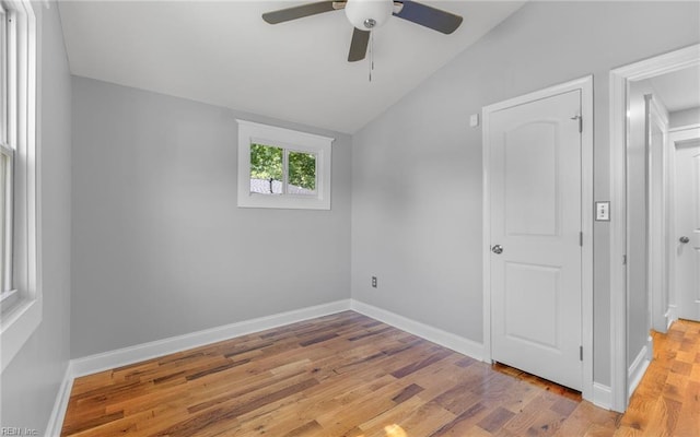 147 Ransone St, Hampton, VA 23669 - unfurnished bedroom with vaulted ceiling, wood finished floors, baseboards, and a ceiling fan