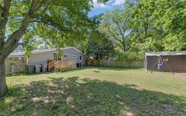 147 Ransone St, Hampton, VA 23669 - view of yard featuring a deck, an outbuilding, a storage shed, and an outdoor fire pit