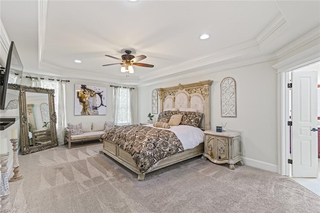 bedroom featuring a raised ceiling, light carpet, ornamental molding, recessed lighting, and baseboards