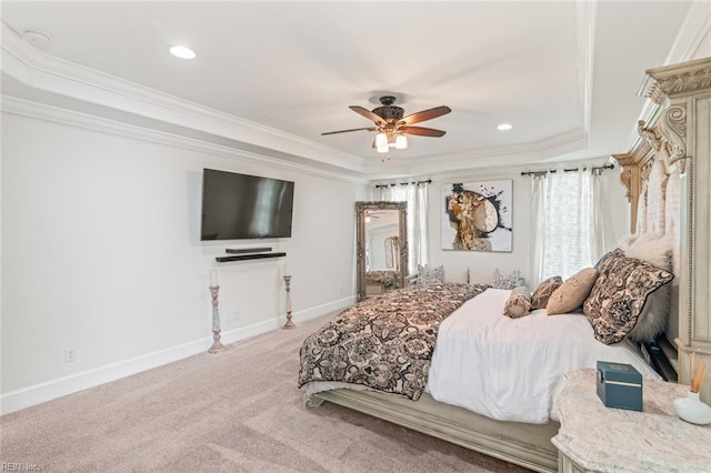 bedroom with a raised ceiling, ornamental molding, light colored carpet, baseboards, and recessed lighting