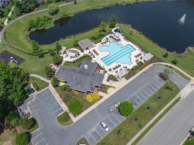 aerial overview of property's location featuring a nearby body of water and a pool