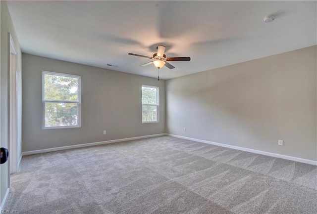 9601 9th Bay St, Norfolk, VA 23518 - carpeted empty room with baseboards, ceiling fan, and a smoke detector