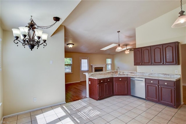 536 Willow Bend Dr, Chesapeake, VA 23323 - kitchen with stainless steel dishwasher, a skylight, a sink, a peninsula, and open floor plan