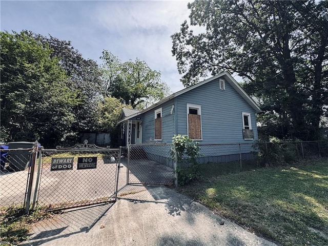 view of front of property with a gate and cooling unit