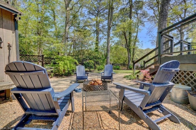 view of patio with a fire pit and stairway