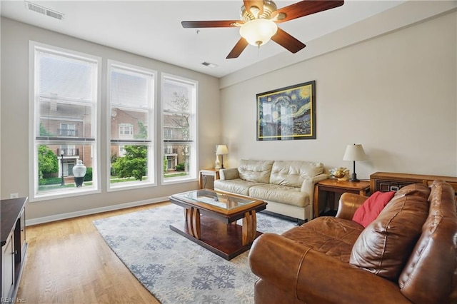 388 Boush St Unit 122, Norfolk, VA 23510 - living room with light wood-type flooring, ceiling fan, and baseboards