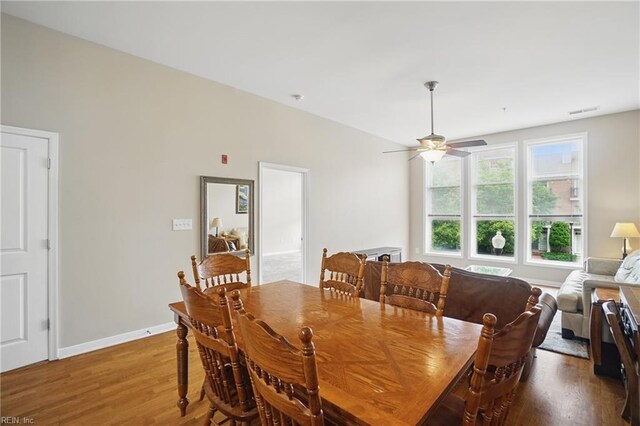 388 Boush St Unit 122, Norfolk, VA 23510 - dining space featuring wood finished floors, a ceiling fan, and baseboards