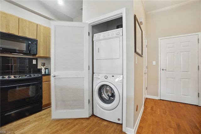 388 Boush St Unit 122, Norfolk, VA 23510 - washroom featuring stacked washing machine and dryer, light wood-style floors, and baseboards