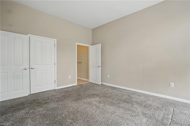 388 Boush St Unit 122, Norfolk, VA 23510 - unfurnished bedroom featuring carpet flooring and baseboards