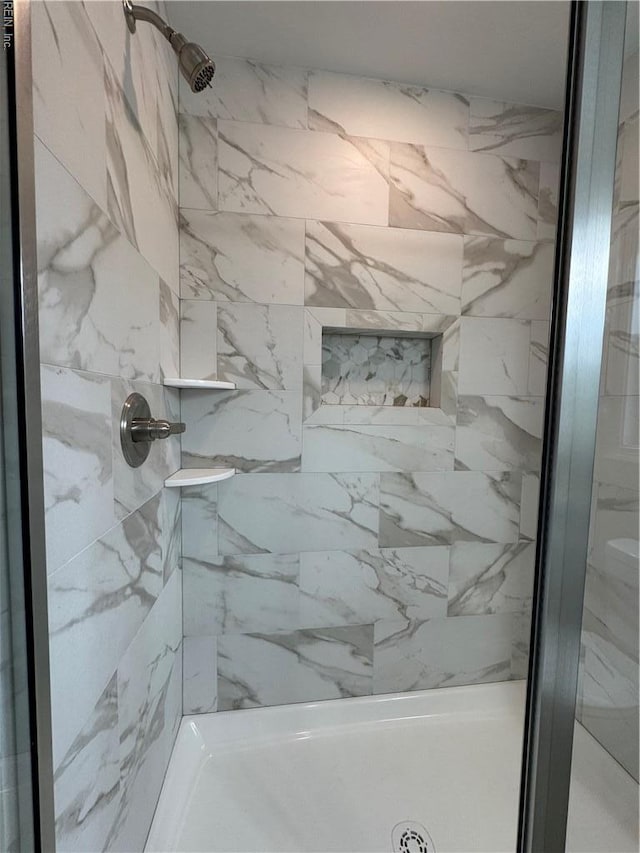 full bath featuring a stall shower