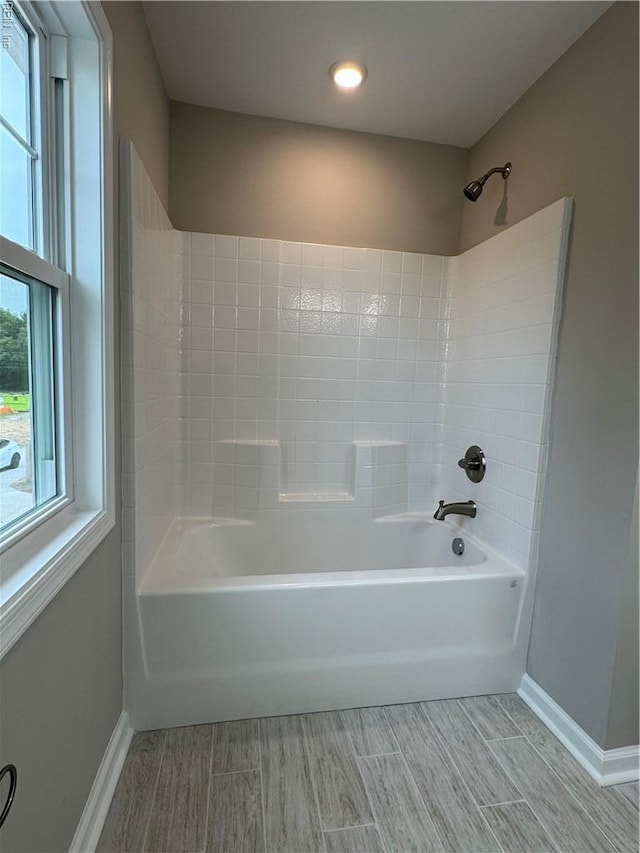 full bathroom with baseboards, wood finished floors, shower / bath combination, and recessed lighting
