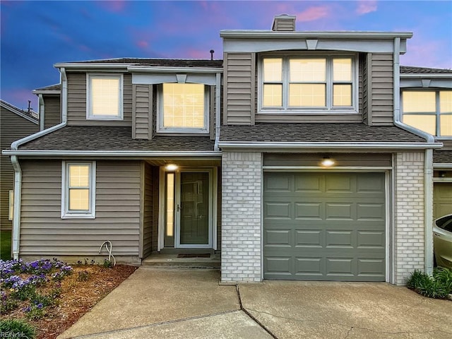5191 Cypress Point Cir, Virginia Beach, VA 23455 - multi unit property with concrete driveway, a chimney, a garage, and brick siding