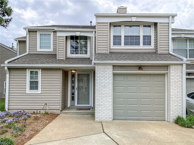 5191 Cypress Point Cir, Virginia Beach, VA 23455 - multi unit property with concrete driveway, a garage, a chimney, and brick siding