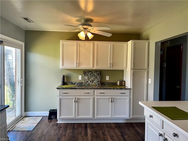 kitchen featuring plenty of natural light, white cabinets, and ceiling fan