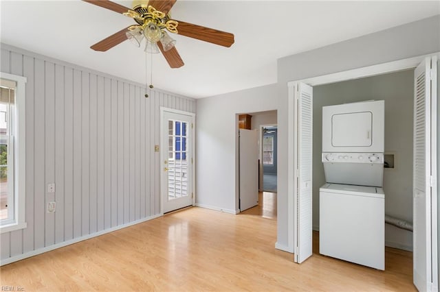 414 Bryan Ct, Newport News, VA 23606 - unfurnished bedroom with estacked washer and dryer, light wood-type flooring, access to exterior, and baseboards