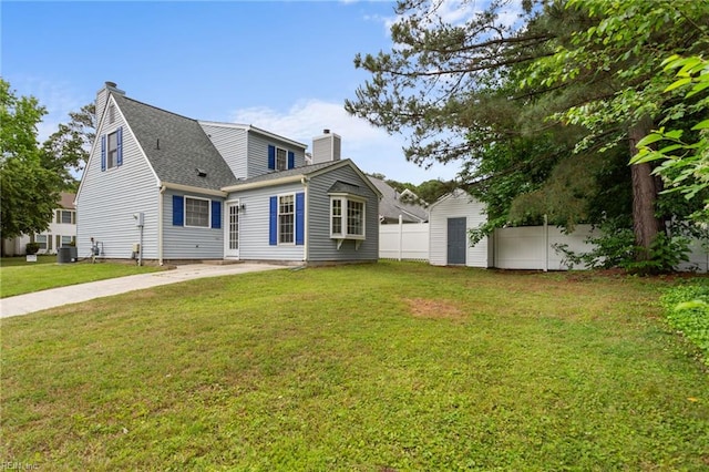 414 Bryan Ct, Newport News, VA 23606 - back of property with a chimney, central AC unit, and a shingled roof