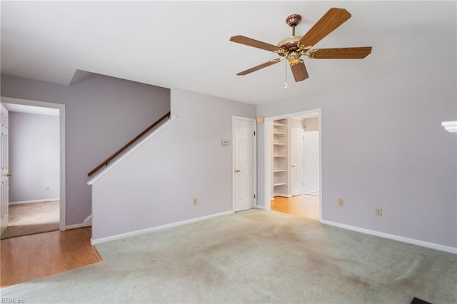414 Bryan Ct, Newport News, VA 23606 - unfurnished living room with carpet, a ceiling fan, stairs, and baseboards