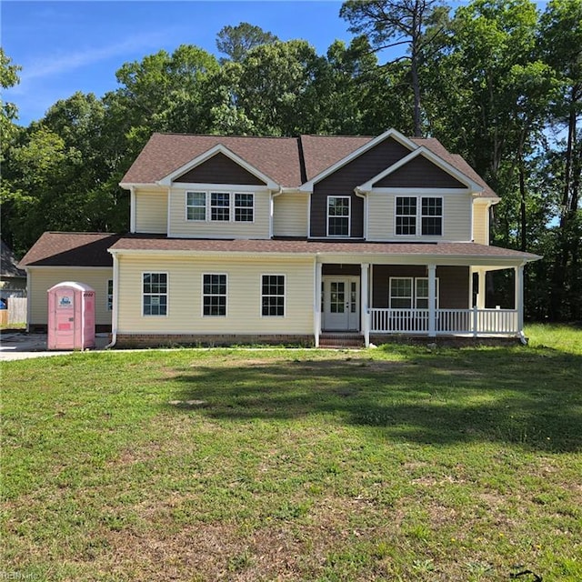view of front facade featuring covered porch and a front lawn