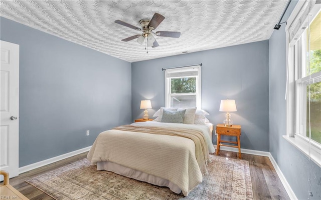 2409 Livesay Rd, Chesapeake, VA 23323 - bedroom featuring wood finished floors, baseboards, and ceiling fan