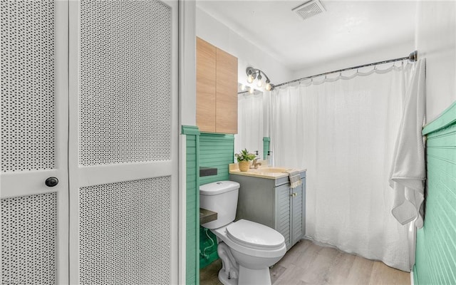2409 Livesay Rd, Chesapeake, VA 23323 - full bathroom with toilet, wood finished floors, and vanity