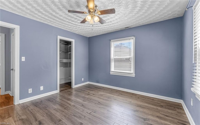 2409 Livesay Rd, Chesapeake, VA 23323 - spare room featuring ceiling fan, baseboards, and wood finished floors