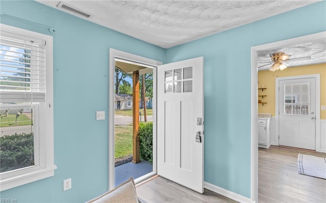 2409 Livesay Rd, Chesapeake, VA 23323 - foyer with wood finished floors, ceiling fan, and baseboards