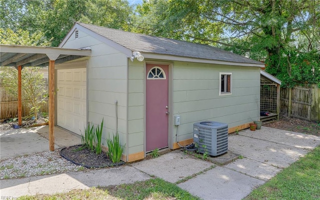 2409 Livesay Rd, Chesapeake, VA 23323 - view of outdoor structure featuring central AC unit, fence, and an outbuilding