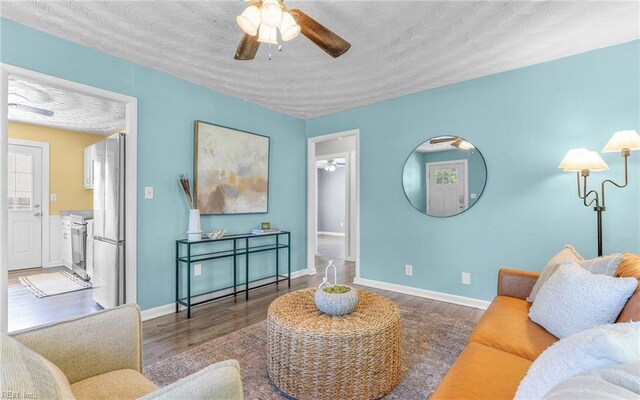 2409 Livesay Rd, Chesapeake, VA 23323 - living room featuring ceiling fan, wood finished floors, a textured ceiling, and baseboards