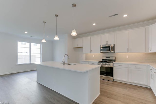 905 Cooper Ln, Chesapeake, VA 23320 - kitchen with appliances with stainless steel finishes, a sink, backsplash, white cabinetry, and recessed lighting