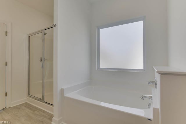 905 Cooper Ln, Chesapeake, VA 23320 - full bathroom with a stall shower, wood finished floors, and a garden tub
