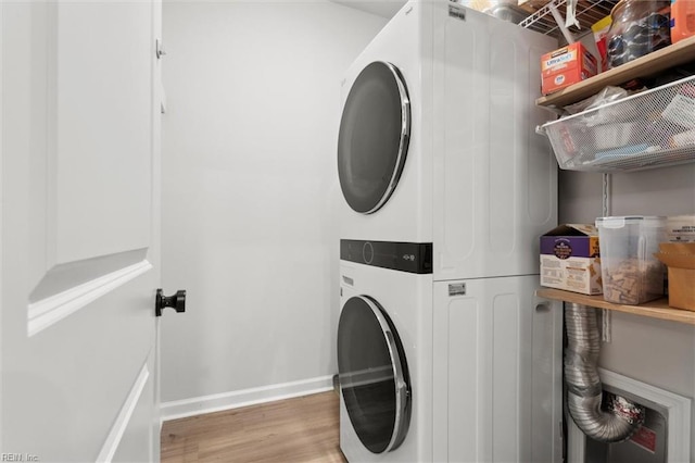 1502 Independence Blvd, Newport News, VA 23608 - washroom with estacked washer and dryer, light wood-style flooring, and baseboards