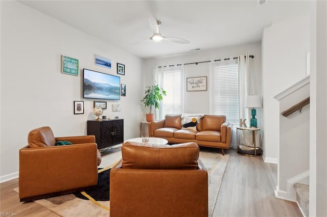 1502 Independence Blvd, Newport News, VA 23608 - living area with light wood-style flooring, stairway, ceiling fan, and baseboards