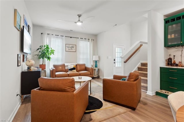 1502 Independence Blvd, Newport News, VA 23608 - living room with light wood-type flooring, healthy amount of natural light, a ceiling fan, and stairs