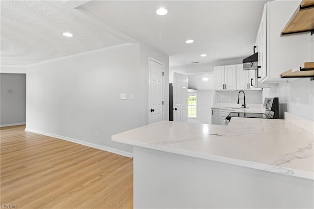 1512 Shell Rd, Chesapeake, VA 23323 - kitchen with light wood-style floors, white cabinetry, recessed lighting, a peninsula, and baseboards