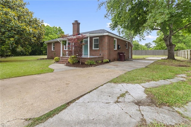 1512 Shell Rd, Chesapeake, VA 23323 - view of front facade with a chimney, brick siding, and concrete driveway