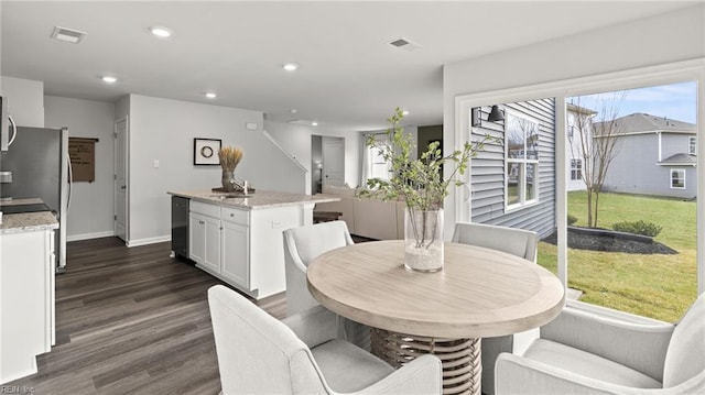 300 Mizzen Way, Elizabeth City, NC 27909 - dining area featuring dark wood finished floors, plenty of natural light, baseboards, and recessed lighting