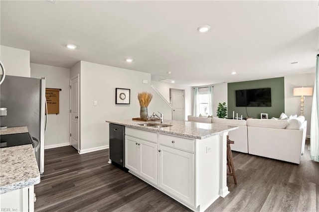 300 Mizzen Way, Elizabeth City, NC 27909 - kitchen with a sink, dark wood finished floors, white cabinetry, dishwashing machine, and a kitchen island with sink