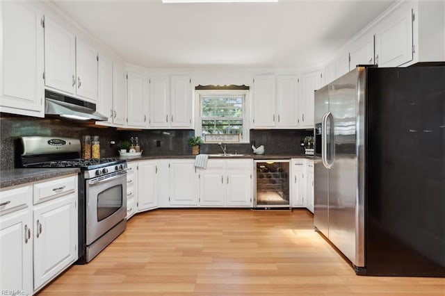 611 Windemere Rd, Newport News, VA 23602 - kitchen with stainless steel appliances, wine cooler, under cabinet range hood, and dark countertops