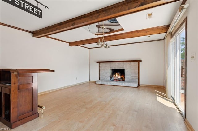 611 Windemere Rd, Newport News, VA 23602 - unfurnished living room with beam ceiling, a brick fireplace, light wood-style floors, baseboards, and a chandelier
