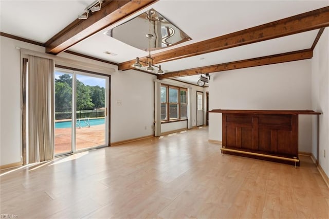 611 Windemere Rd, Newport News, VA 23602 - unfurnished living room featuring beam ceiling, a chandelier, healthy amount of natural light, light wood-style flooring, and baseboards