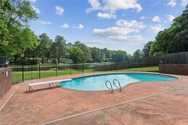 611 Windemere Rd, Newport News, VA 23602 - view of swimming pool with a patio area, a diving board, and view of scattered trees