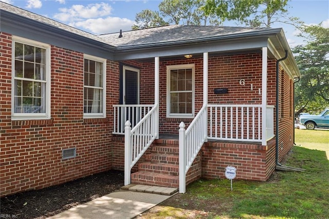 611 Windemere Rd, Newport News, VA 23602 - property entrance featuring brick siding, a porch, crawl space, and roof with shingles