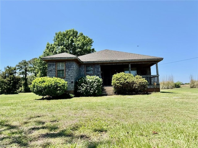 512 S End Rd, Knotts Island, NC 27950 - view of front facade featuring a front yard and covered porch