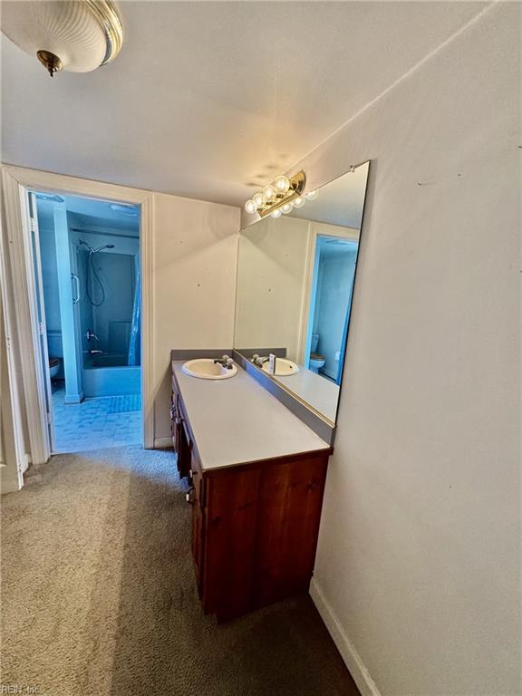 512 S End Rd, Knotts Island, NC 27950 - bathroom with vanity and baseboards