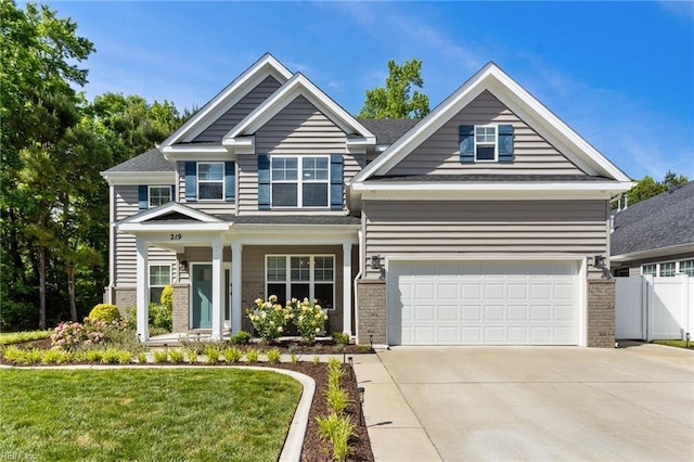 219 Dunway Ln, Chesapeake, VA 23323 - craftsman house featuring brick siding, concrete driveway, and a garage