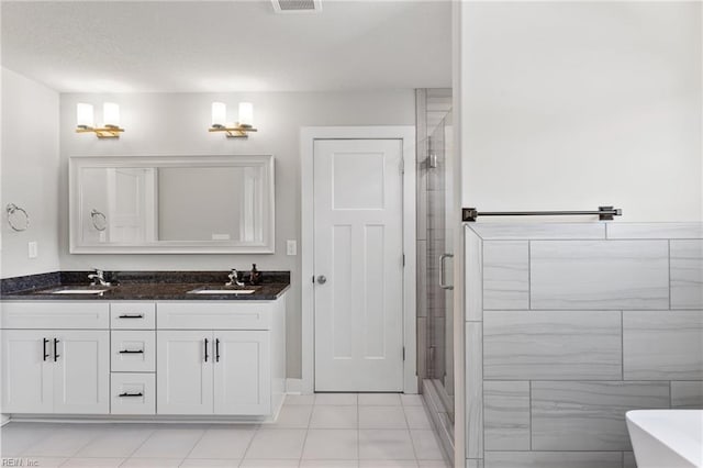 219 Dunway Ln, Chesapeake, VA 23323 - full bath featuring a stall shower, double vanity, a soaking tub, and tile patterned flooring