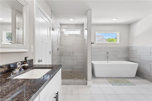 219 Dunway Ln, Chesapeake, VA 23323 - full bathroom featuring a shower stall, vanity, a freestanding bath, and tile patterned floors