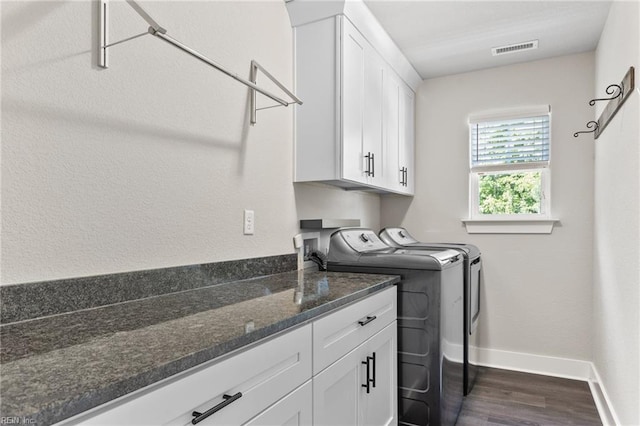 219 Dunway Ln, Chesapeake, VA 23323 - laundry room featuring washing machine and clothes dryer, cabinet space, dark wood-type flooring, and baseboards