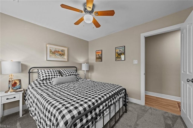 bedroom with carpet floors, baseboards, and ceiling fan